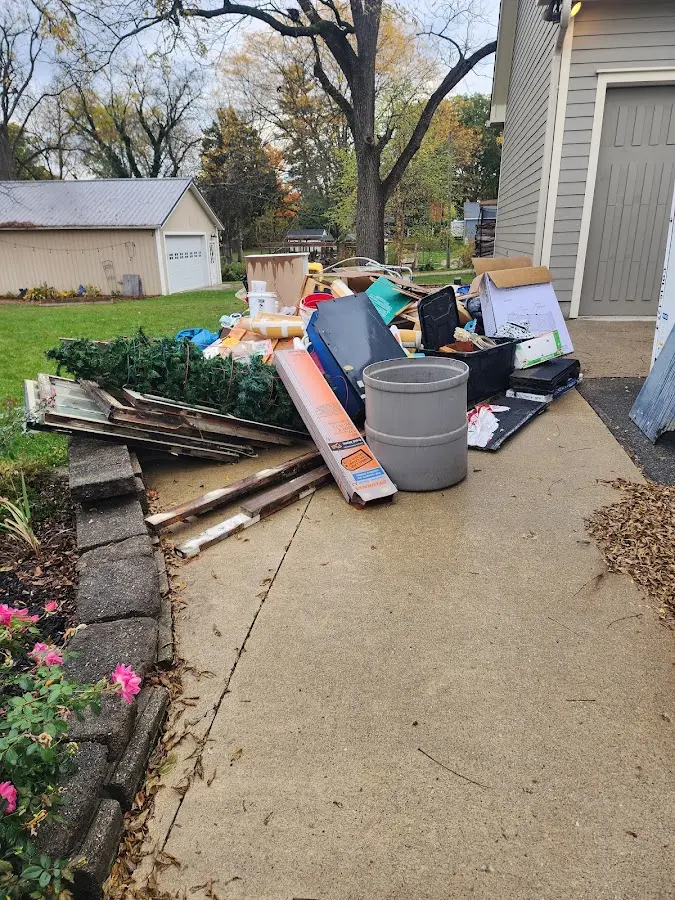 Dumpster being loaded with debris for 3 Yard Dumpster Rental in Rancho Cordova